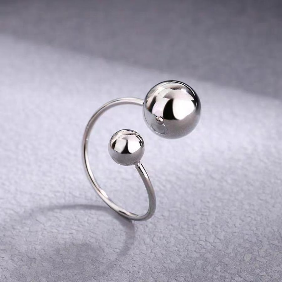 Bague ouverte argentée à doubles boules
