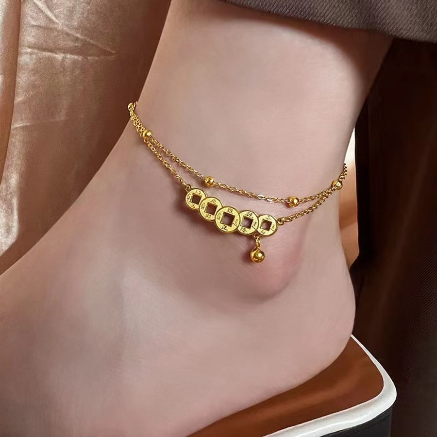 Chaîne de cheville dorée à charms multiples