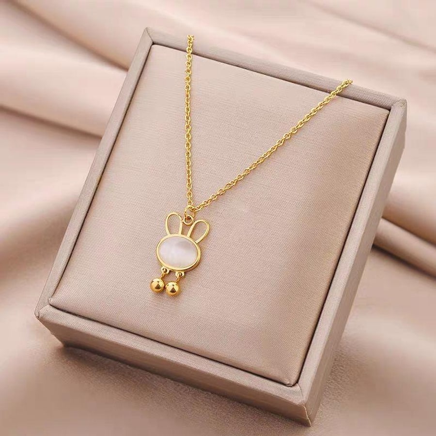 Collier doré avec pendentif perle en coffret